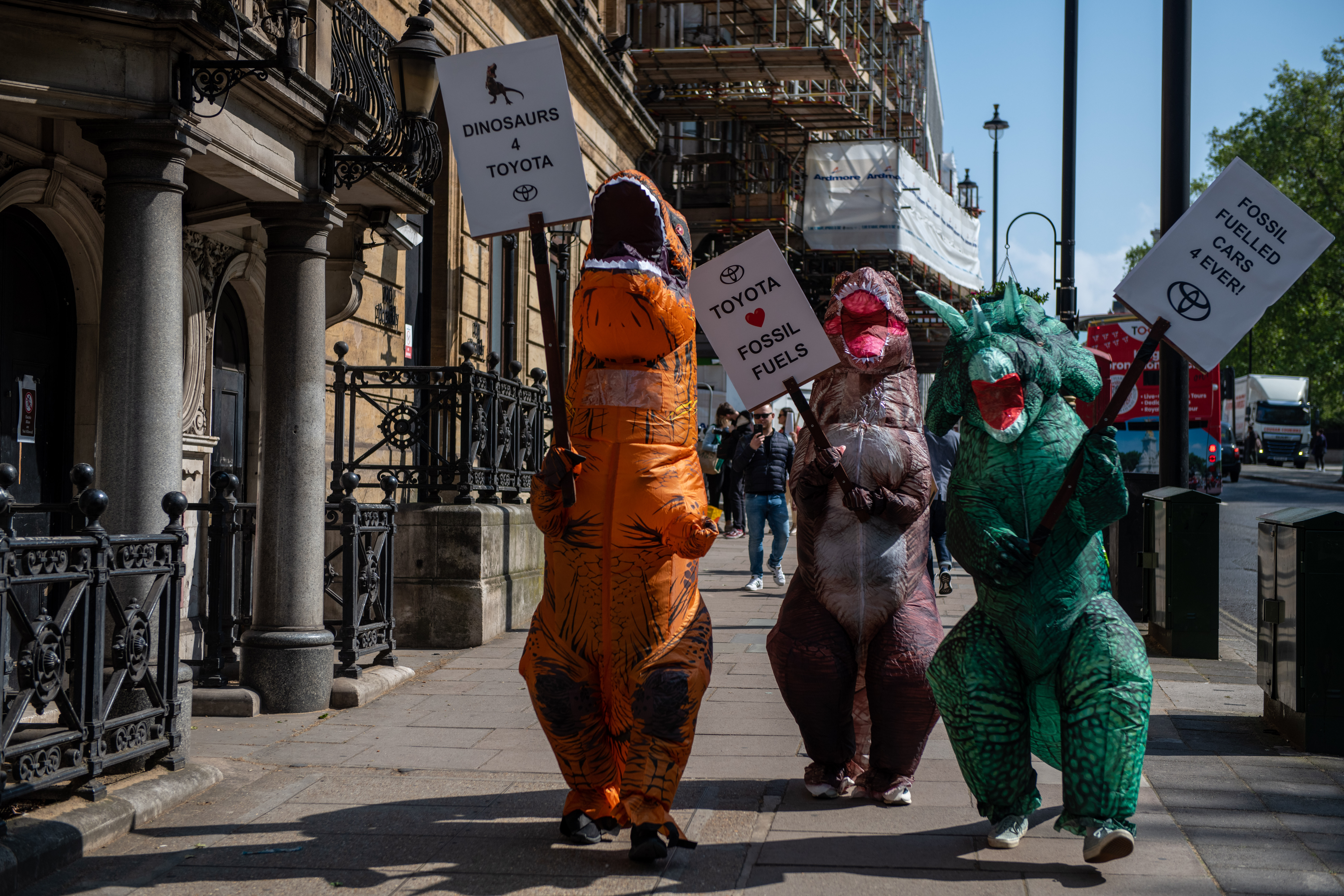 Dinosaur protest in London calls out Toyota 