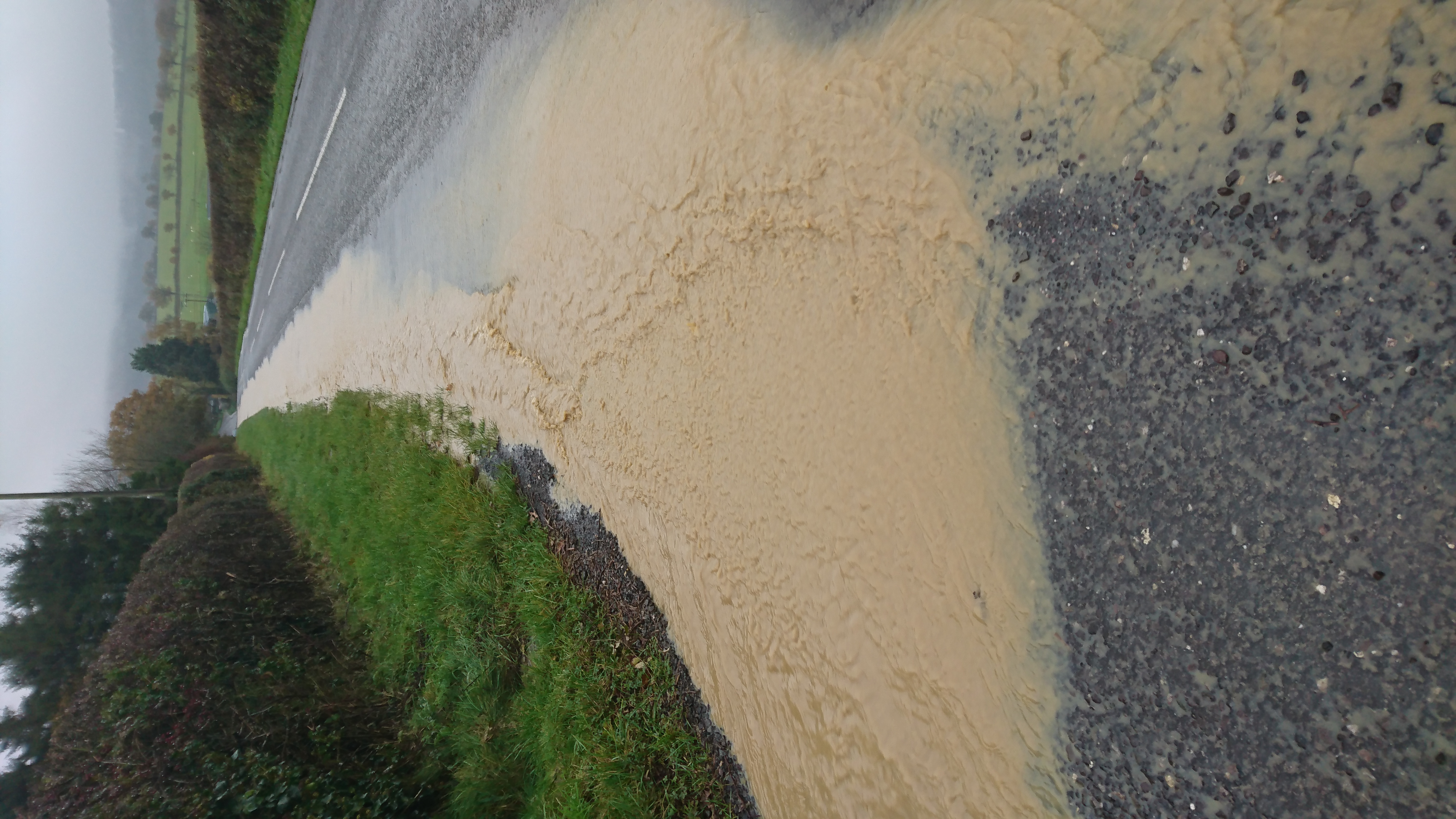 Soil and water running off damaged farmland and into local roads, in Somerset, November 2019