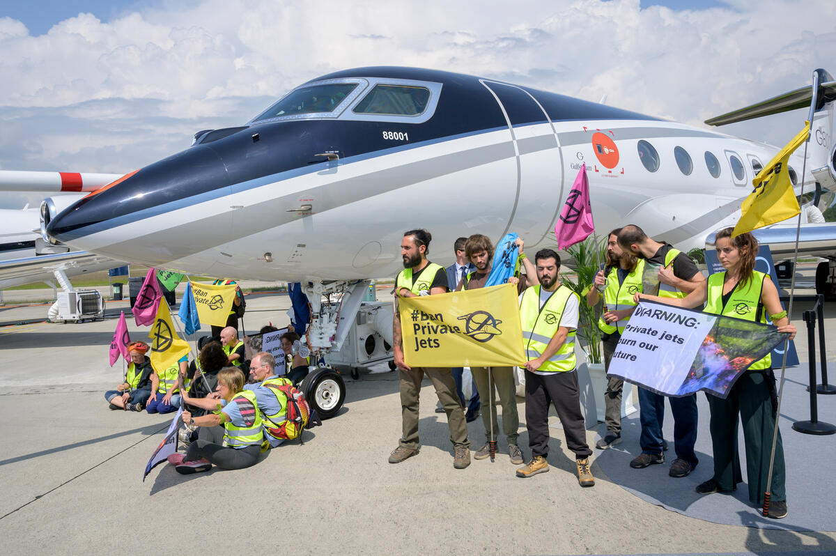 Activists protest private jets at Geneva airport - photo credit - Greenpeace.